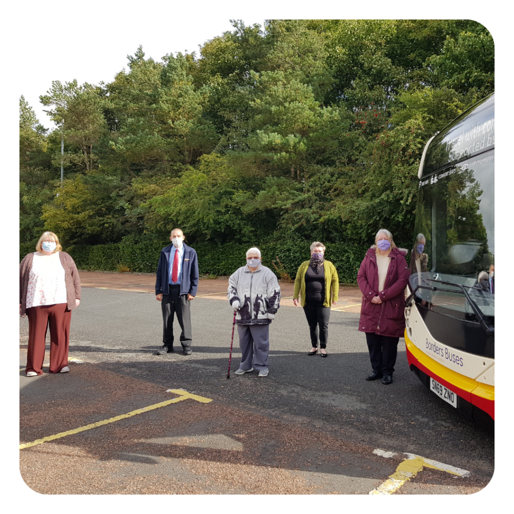 Local people making a Covid-safe bus travel video