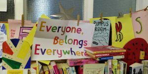 Colourful poster reading Everyone belongs everywhere